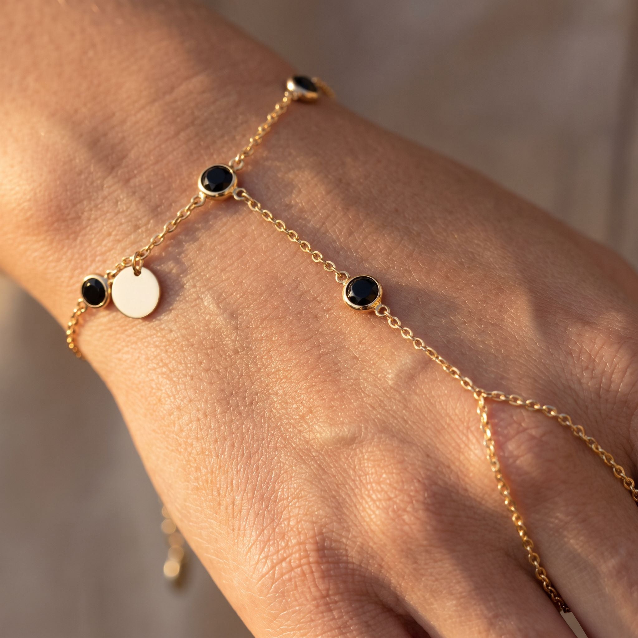 Rivière Onyx Hand Chain - detail on skin