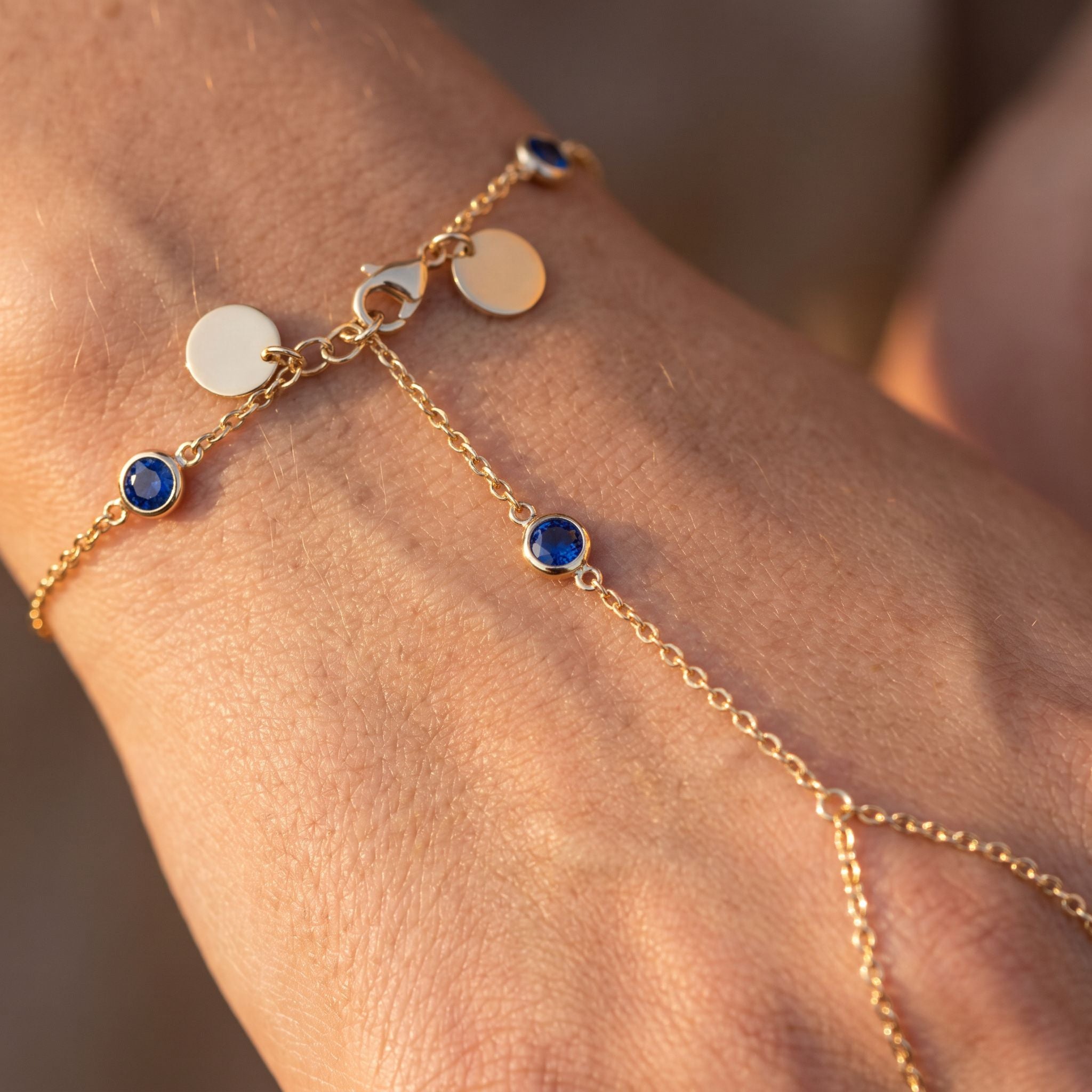 Rivière Sapphire Hand Chain - detail on skin