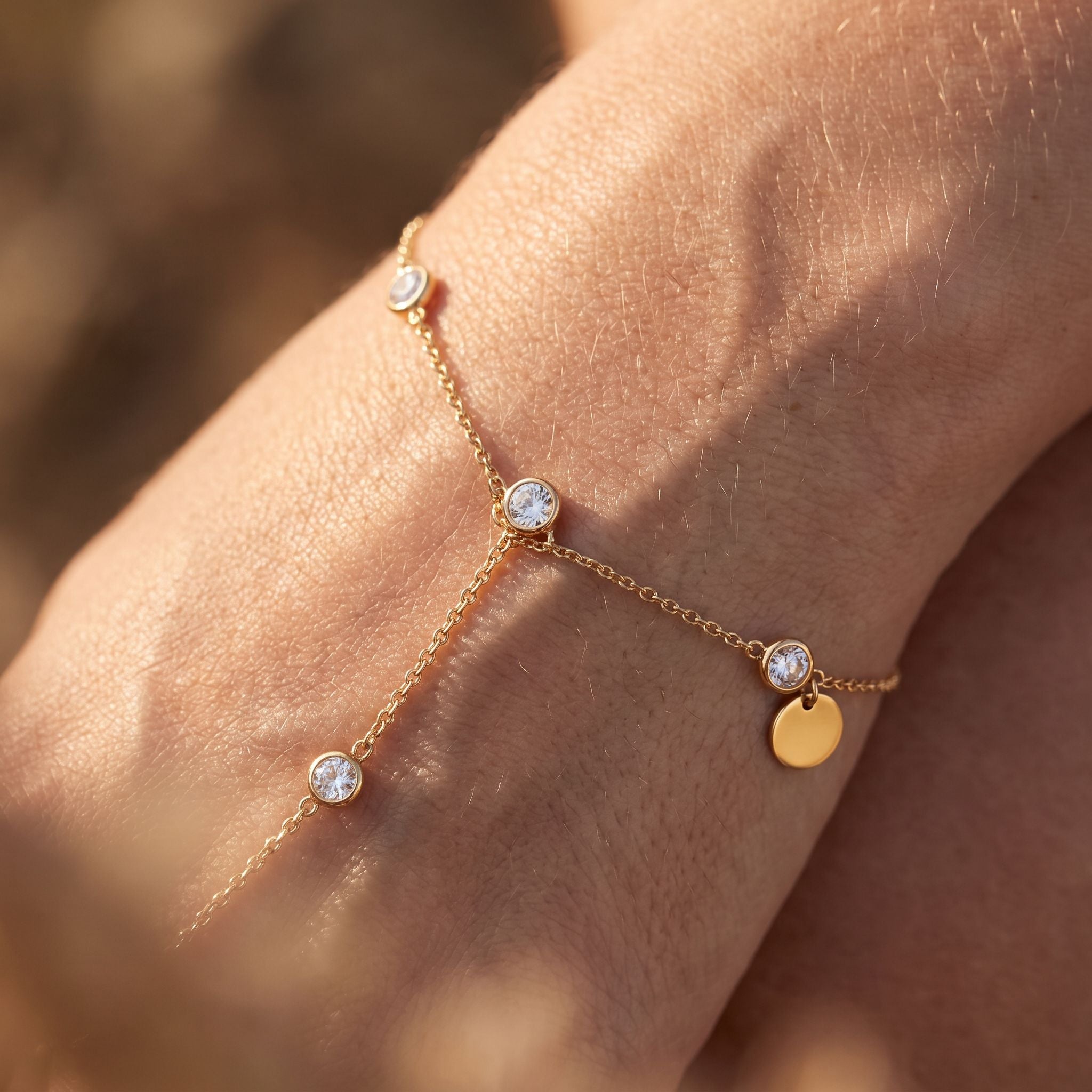 Rivière Gold Hand Chain - detail on skin