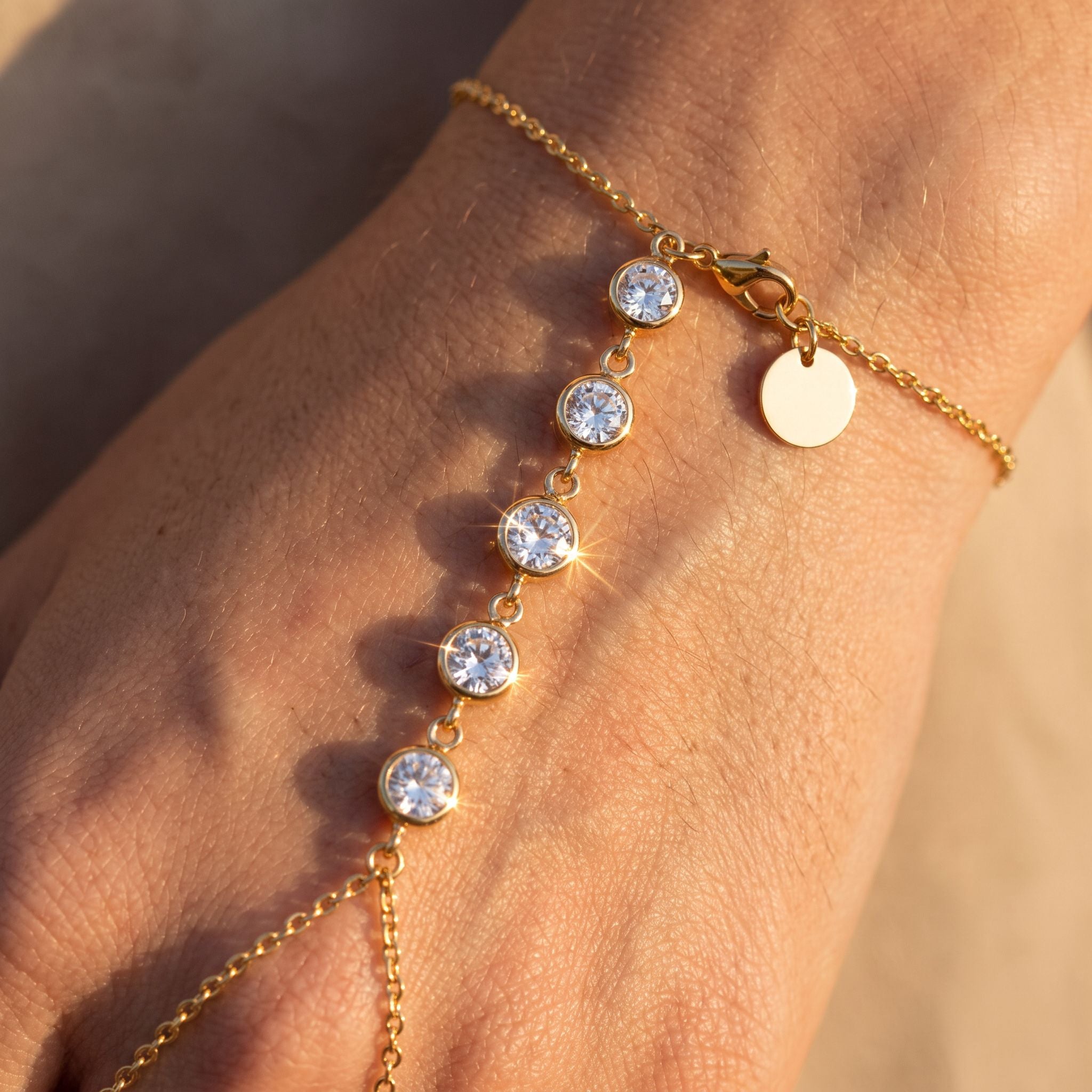 Étincelle Gold Hand Chain - detail on skin